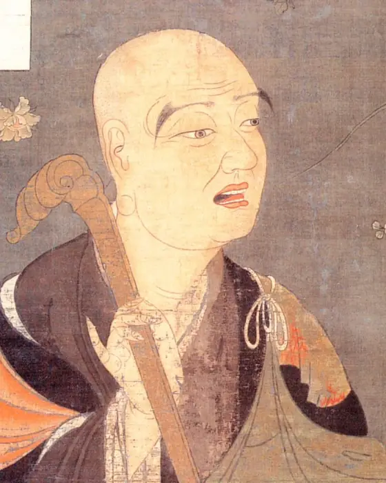 A painting of an elderly monk turned in three-quarter view, holding a staff.