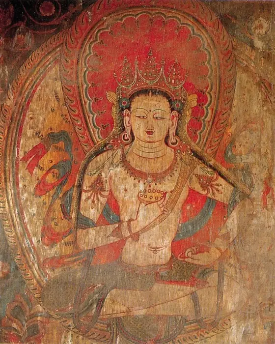 A wall painting of a serene crowned bodhisattva in red, gold and green.