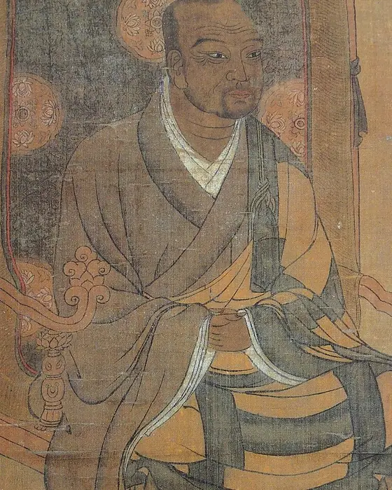 A faded painting of a monk seated on a chair with his shoes on a footstool.
